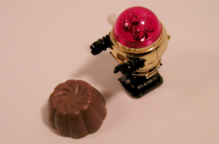 toy robot eating a chocolate